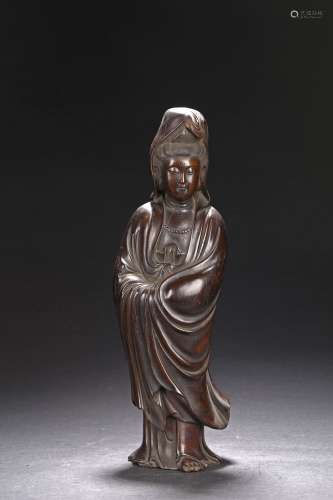 A HARDWOOD CARVED STANDING GUANYIN FIGURE