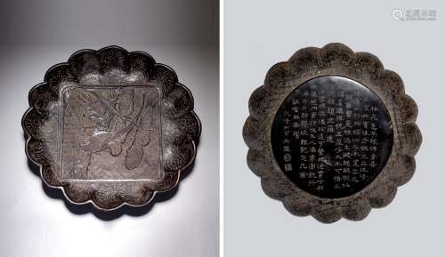 A CHINESE BLACK LACQUERED 'BIRD' INSCRIBED DISH