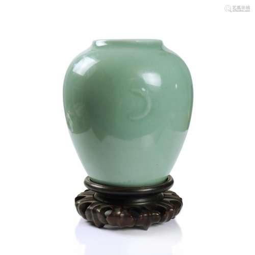 A Chinese Celadon Glazed Porcelain Jar With Wood Stand