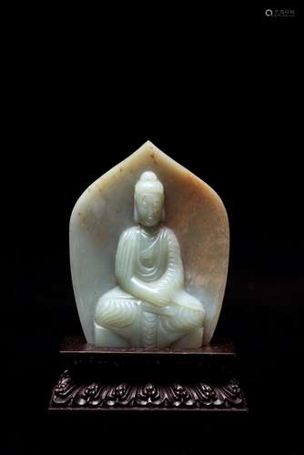 A CHINESE CELADON JADE CARVED AMITABHA