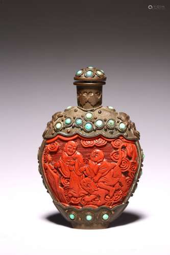 A CARVED CINNABAR LACQUER BRONZE SNUFF BOTTLE