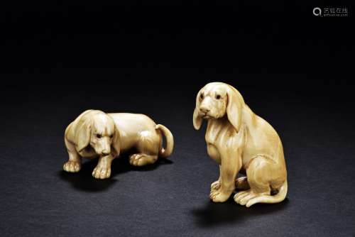 A PAIR OF TWO ANTIQUE BONE CARVED 'DOGS'