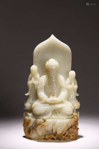 A WHITE JADE CARVED BUDDHA AND ATTENDANTS