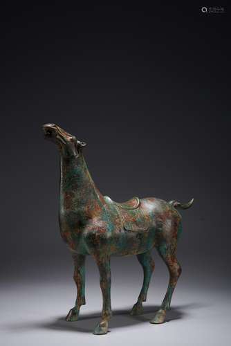 AN ARCHAISTIC BRONZE INSCRIBED HORSE