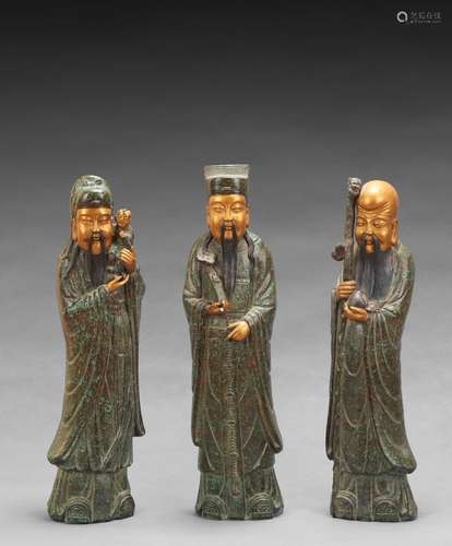 A GROUP OF THREE LARGE PORCELAIN FIGURES OF IMMORTALS