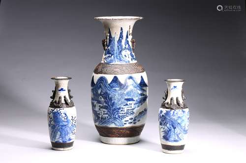 A GROUP OF THREE BLUE AND WHITE CARVED VASES