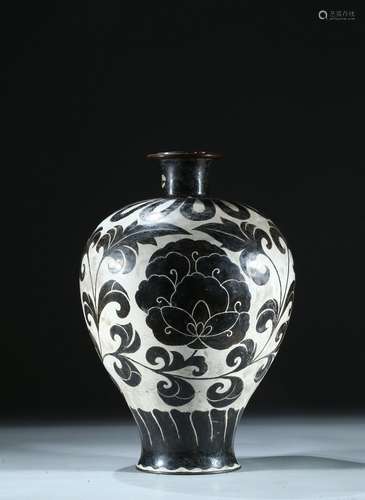 A BRONZE WHITE GROUND BLACK FOLIATE SCROLL DECORATED VASE