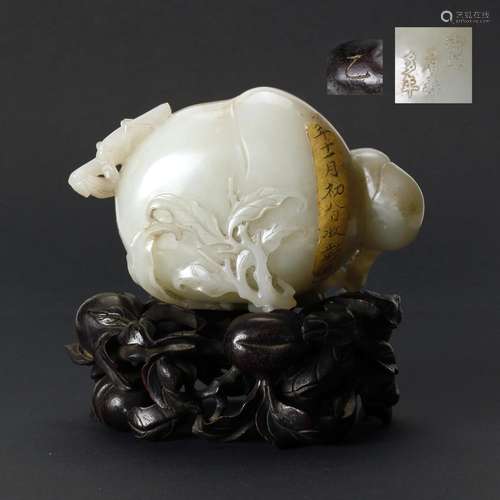 A Chinese White Jade Carved Peach With Zitan Hardwood Stand