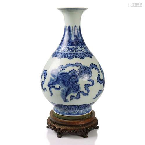 A Chinese Blue And White Glazed Porcelain Vase With Wood Sta...