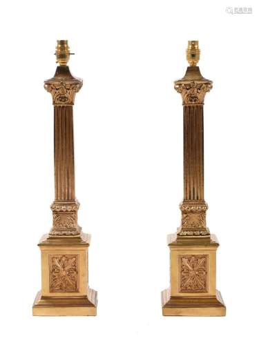 A pair of gilt metal columnar table lamps