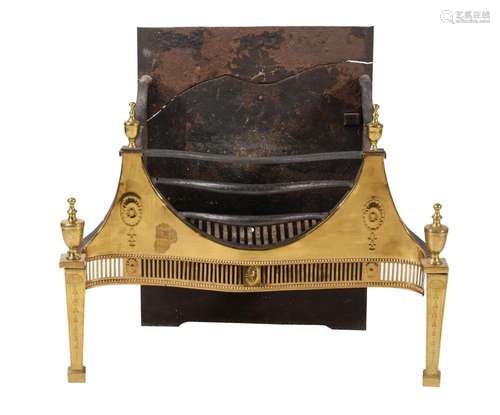 A George III brass and cast iron fire grate in neo-classical...