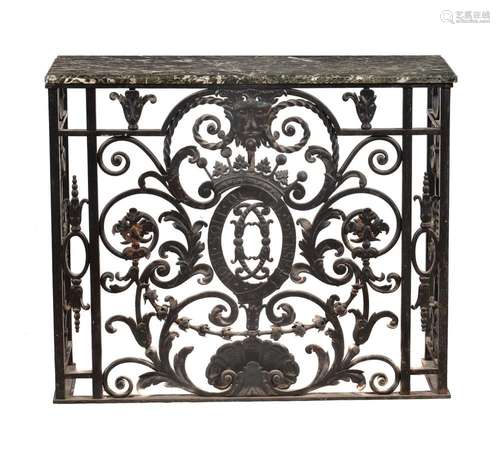 A wrought iron and marble topped side table