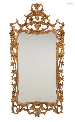 A carved giltwood wall mirror in George II style