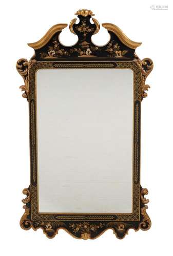 A modern Italian giltwood and black lacquered wall mirror in...