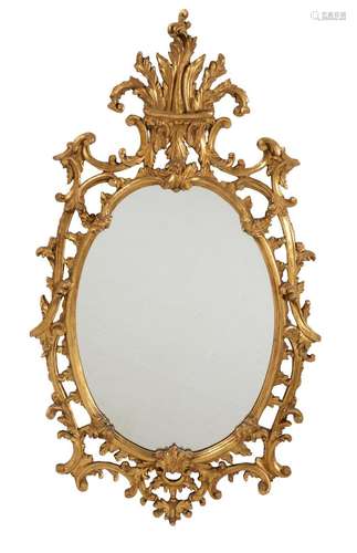 A modern Italian carved giltwood cartouche wall mirror