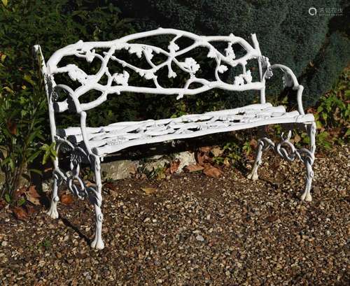 A white painted cast iron garden bench or 'Rustic Settee...