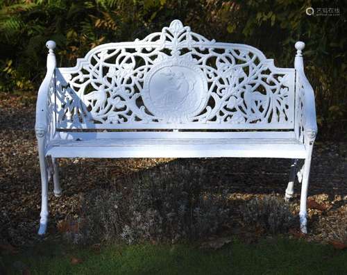 A white painted cast iron bench