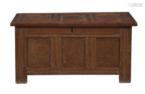 A panelled oak chest or coffer