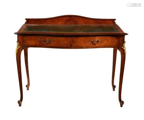 A mahogany and parcel gilt writing desk