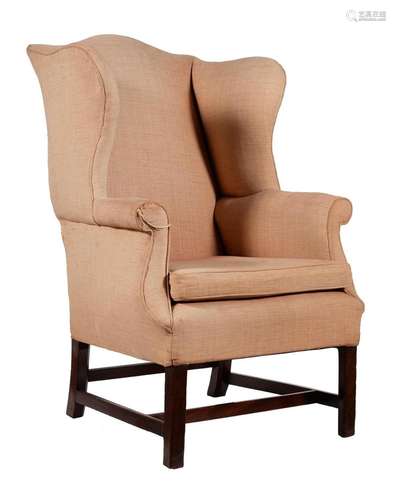 A George III mahogany and upholstered wing armchair