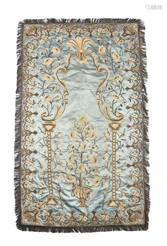 A blue silk and embroidered entre fenetre