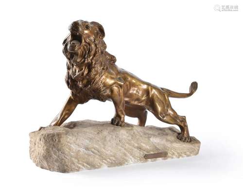 A bronze model of a lion on a stone base