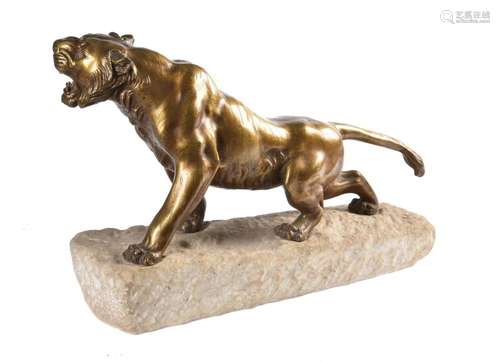 A bronze model of a tiger on a stone base