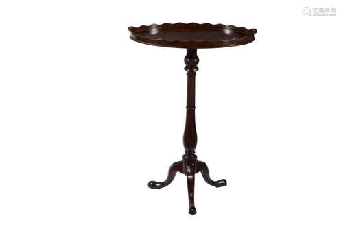 A mahogany tripod table