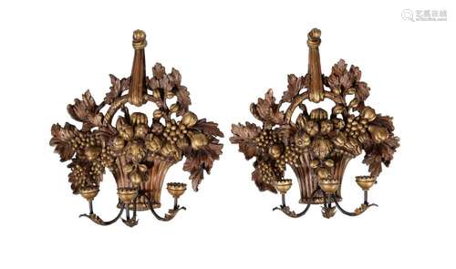 A pair of carved and giltwood three light wall appliques in ...