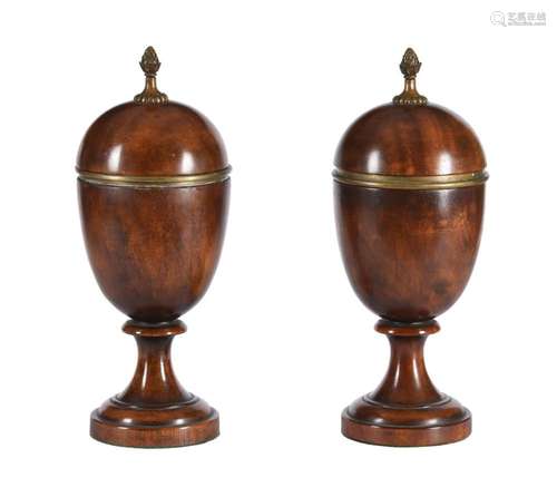 A pair of carved wood and gilt metal mounted urns and covers...