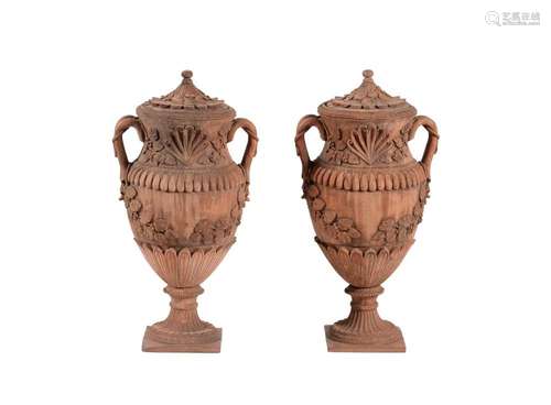 A pair of terracotta twin handled baluster urns and covers, ...