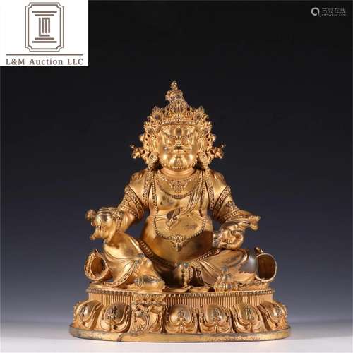 A Chinese Gilt Bronze God of Wealth Buddha Statue