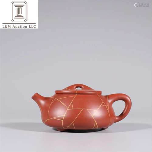 A Chinese Yixing Net Patterned Teapot