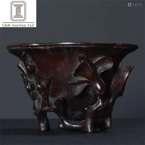 A Chinese Carved Zitan Wood Plum Blossom Cup