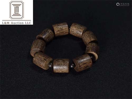 A Chinese Carved Agarwood Bracelet