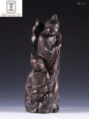 A Chinese Carved Agarwood Immortal Statue