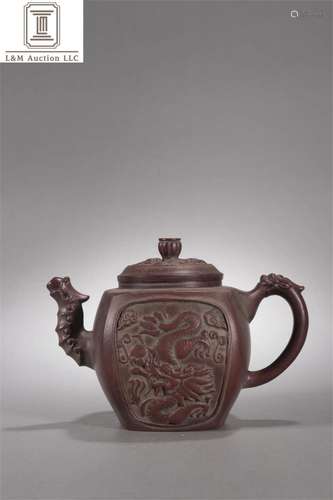 A Chinese Carved Yixing Zisha Dragon Patterned Teapot