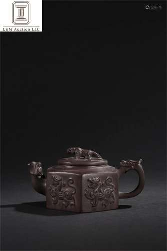 A Chinese Yixing Zisha Beast Patterned Teapot