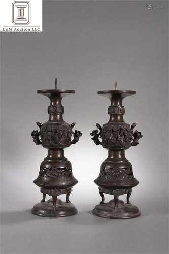 A Pair of Bronze Candlesticks