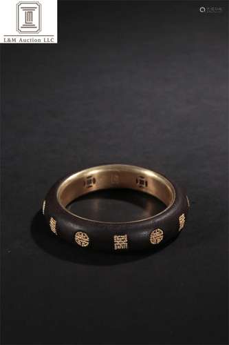 A Chinese Carved Agarwood Shou Patterned Bracelet