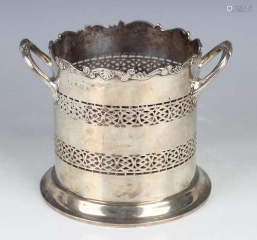 A George V silver two-handled syphon stand with scroll and s...