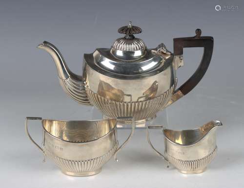 An Edwardian silver three-piece bachelors tea set of oval ha...