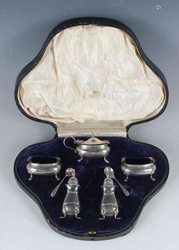 An Edwardian silver five-piece condiment set of oval form, c...