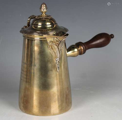 An early 20th century French silver gilt chocolate pot, the ...