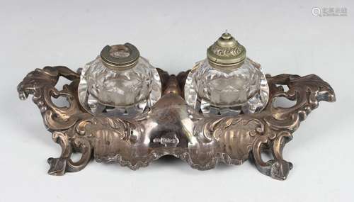 A Victorian silver rococo scroll moulded ink stand, the fron...