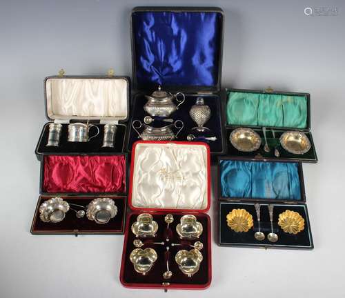 A set of four Edwardian silver salts of trefoil form with be...