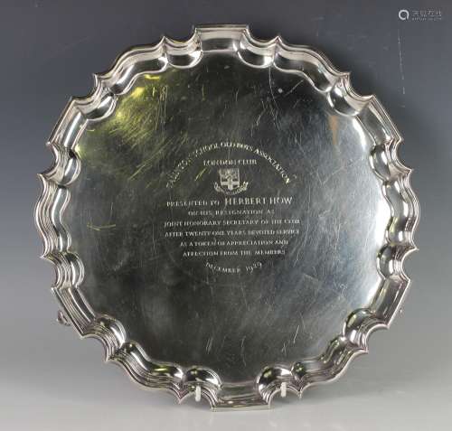A George V silver circular salver, the centre presentation i...