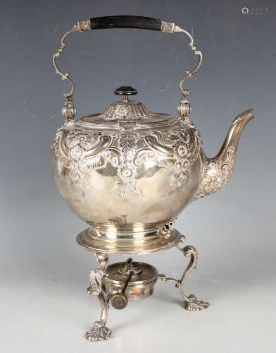A late Victorian silver spirit kettle and heater stand, the ...