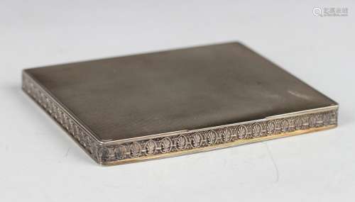 A George VI silver rectangular compact with engine turned de...