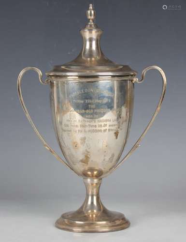 An Elizabeth II silver trophy cup and cover with urn finial,...